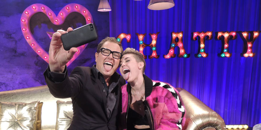 Alan Carr and Miley Cyrus take selfie on the set of Alan Carr Chatty Man